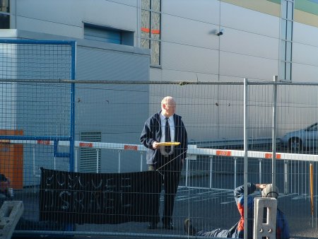 Manager Amos Orr serves tea to activists at the exit