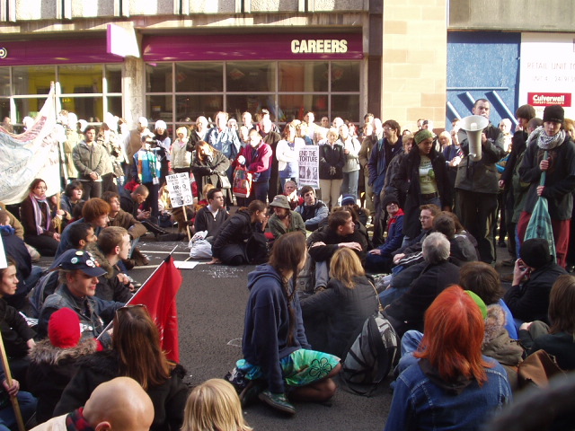 Sit-down protest outside armed forces recruiting office in Queen Street.