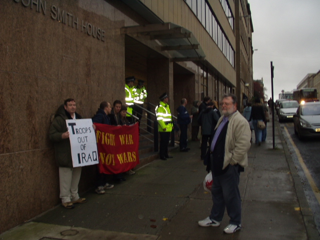 Protesters and police outside John Smith House.