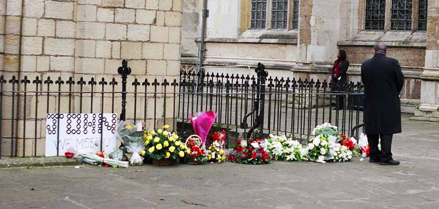 Floral tributes - under 'heavy' gaurd.