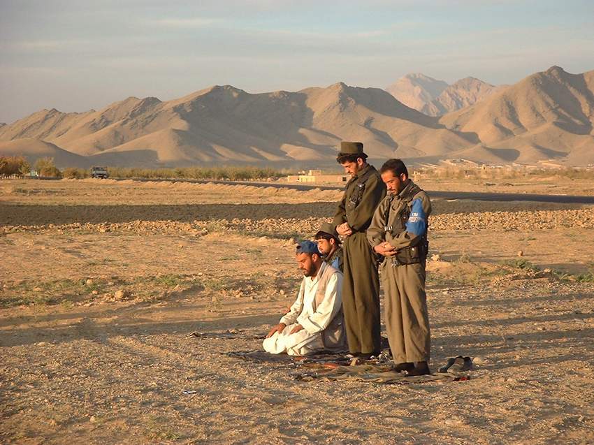 Police praying at dusk