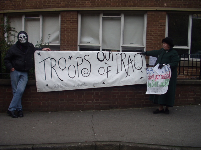 `Troops Out of Iraq` banner.