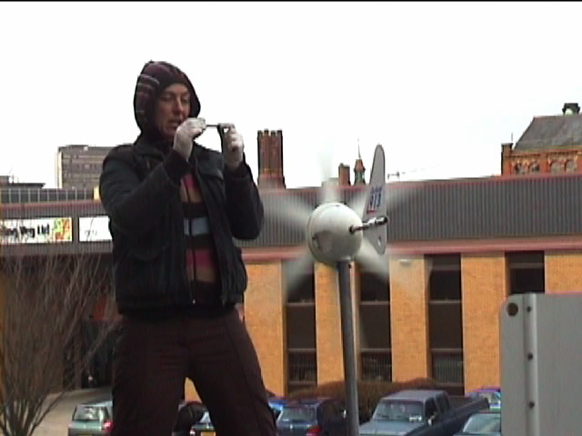 Kaye giving a session on practical renewable energy applications atop her truck
