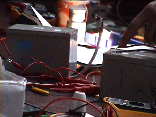People get their hands dirty setting up solar panels