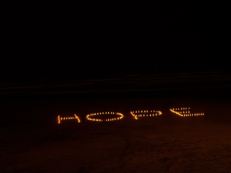 H-O-P-E Spelled out at Ocean Beach, San Francisco, with 300 homemade lanterns