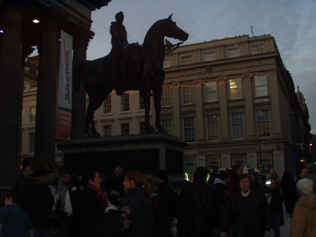 Crowd gathering by Wellington statue. Note absence of usual traffic cones.
