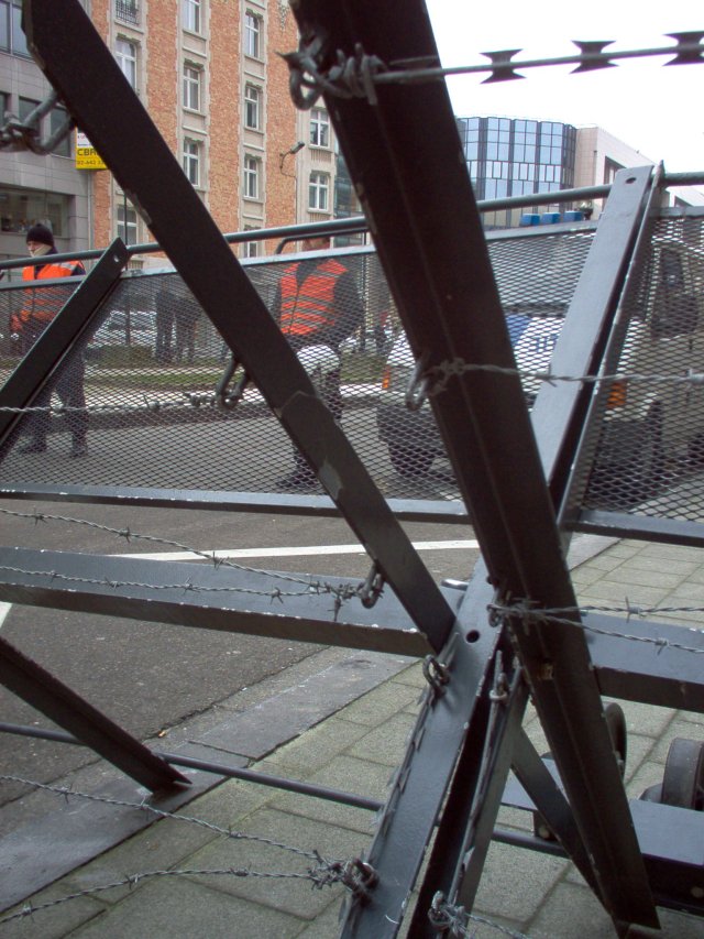 Crowd control barriers and riot police