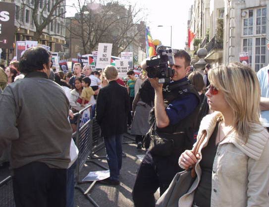 (taking pictures of people talking to each other)