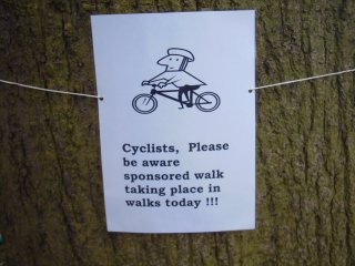 Friendly notices to cyclists were placed near sharp bends