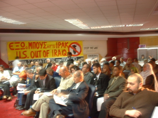 Audience listens keenly.