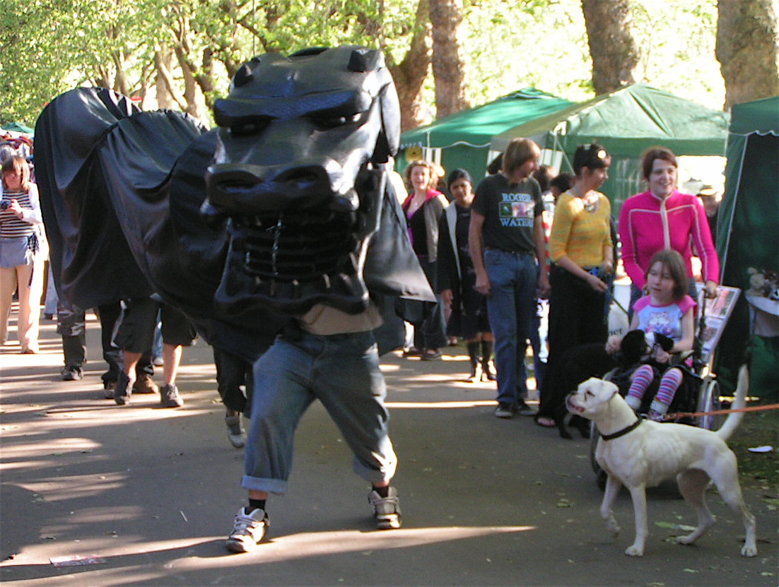 Procession F - white boxer barks at black dragon