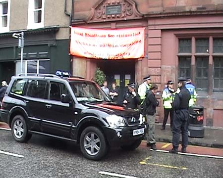 Police stopping people outside IMC Centre