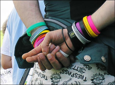 Coloured charity wristbands worn by reveller