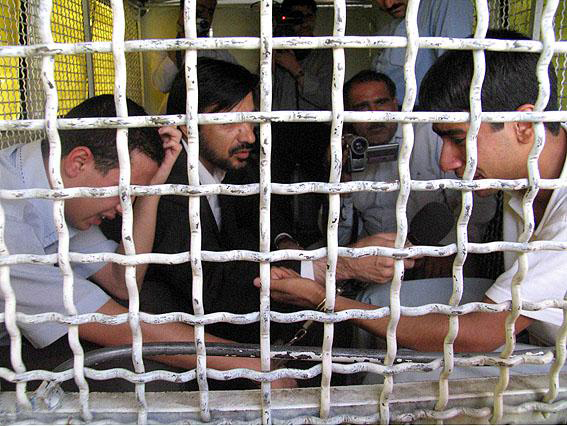 The boys are brought to the place of execution. One is weeping, the t