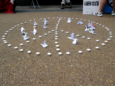 CND logo with candles and birds