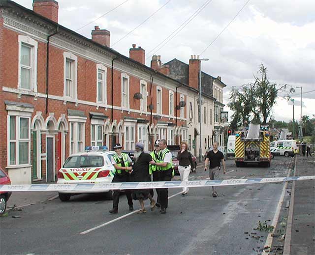 elderly man 'escorted' by police - plain clothes officers following