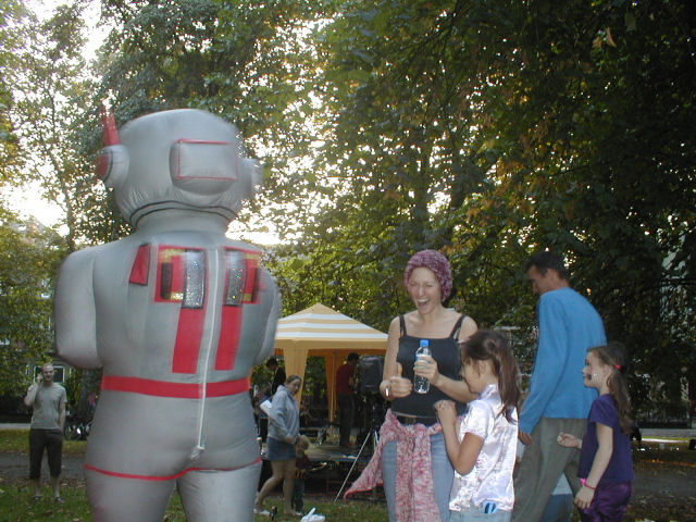 People everywhere express emtion as the robot looks for the leader...