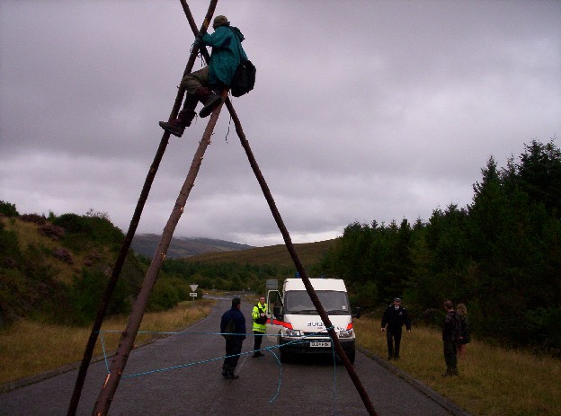 Police climbing crew used a tower to remove the tripod activist.