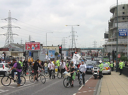 cyclists and others offer support - clapping, cheering then blockading