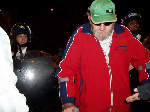 man on crutches being pushed