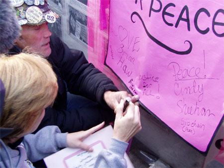 signing the pink banner