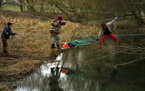 a tree fall injury being stretchered off rickety bridge island
