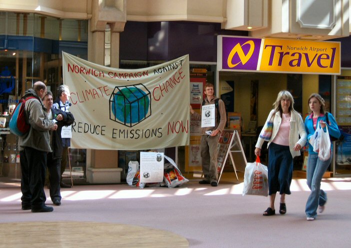 protestors and shoppers outside shop