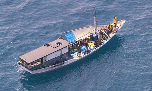 Arriving by boat and dumped off shore