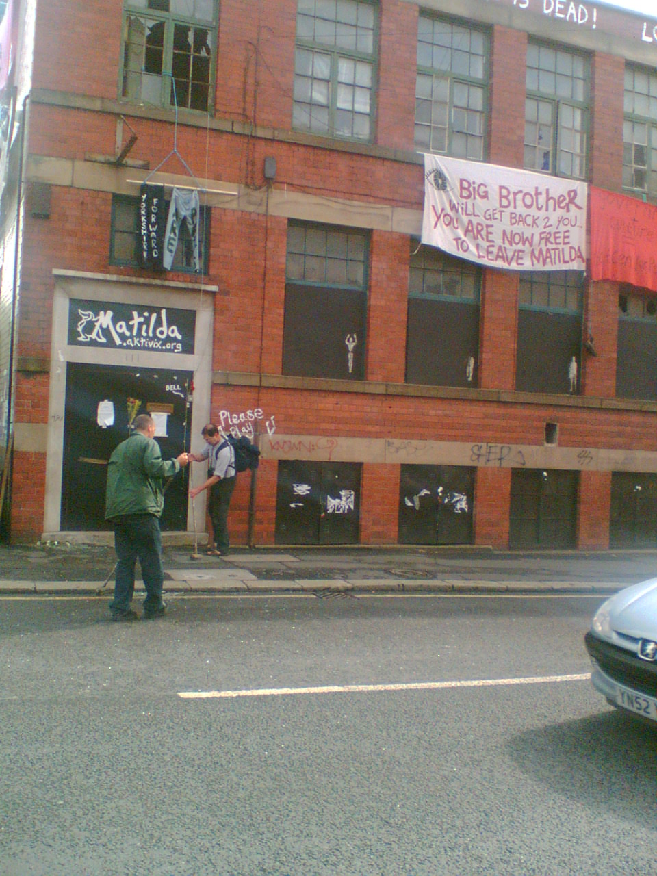 Cleaning up glass after windows were broken in anger