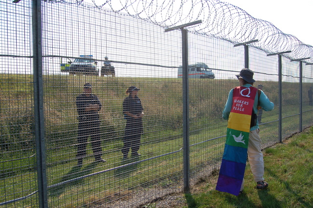 MOD Police behind the fence