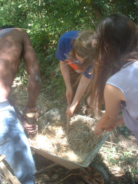 mixing up some brick mix from straw and stuff