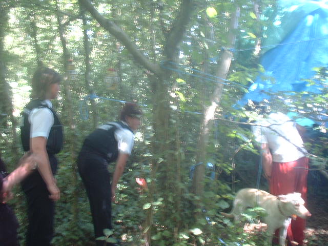 police, minus their hats and tool belts, are given a tour of the site