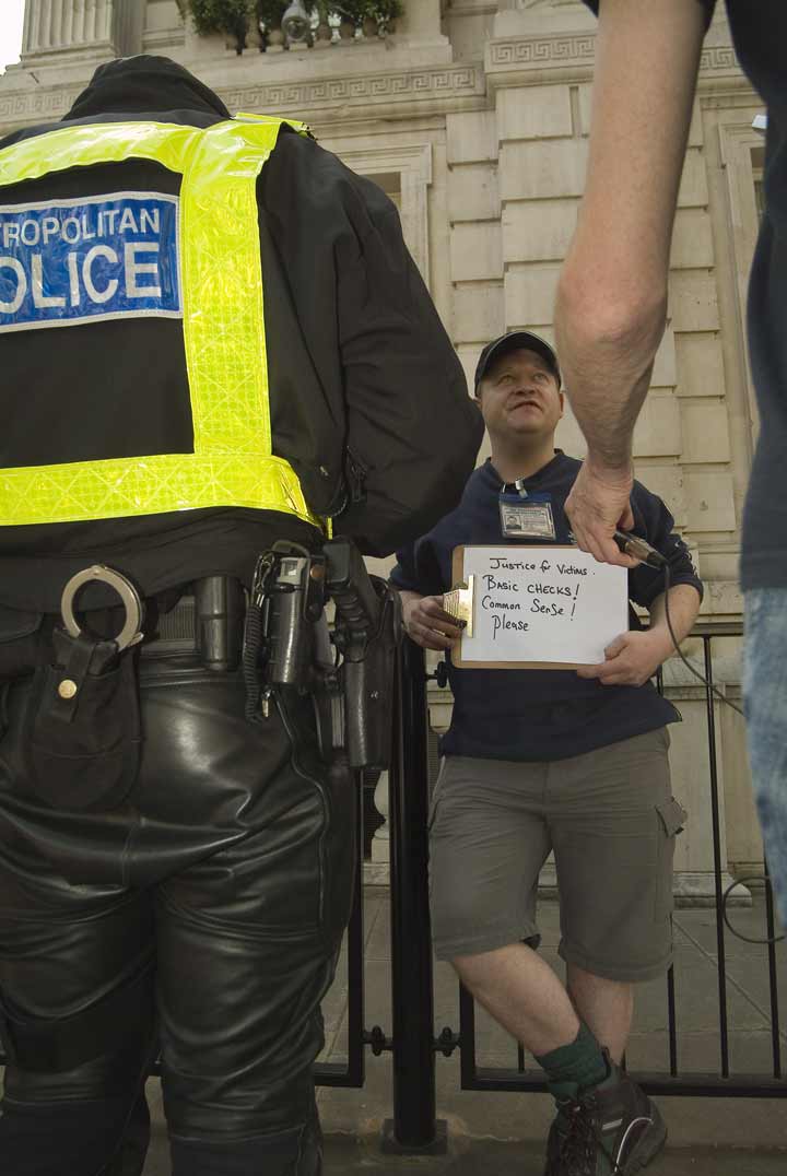 Headless Copper with Mark's Campaign Placard: Equal Rights for All Victims!