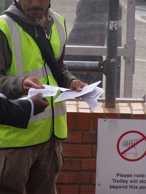 handing out leaflets