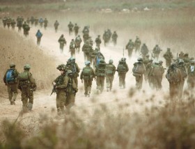 Zionist paratroops make their way to a village in south Lebanon
