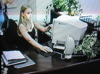 FBI staff using a computer after the raid
