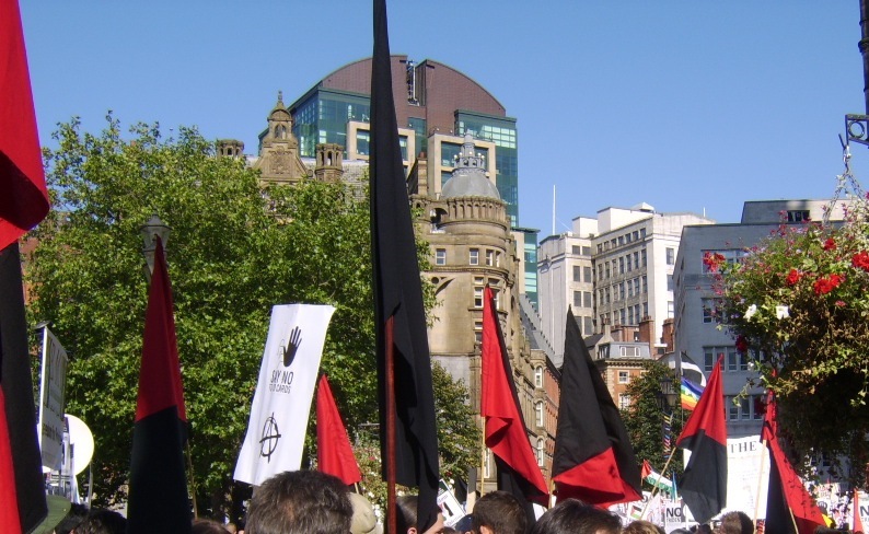 Anarchist flags on the anti-war march - red and black