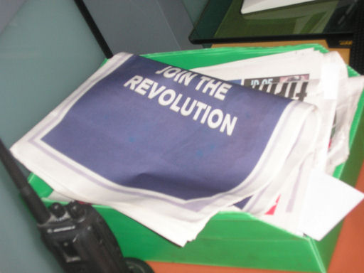 What the man on the security desk is reading