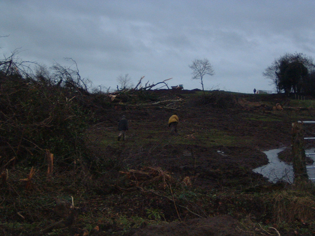 Jan 3 - The first demonstrators jump the fence and run towards the machines