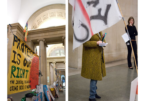 The display, and a critic makes notes.