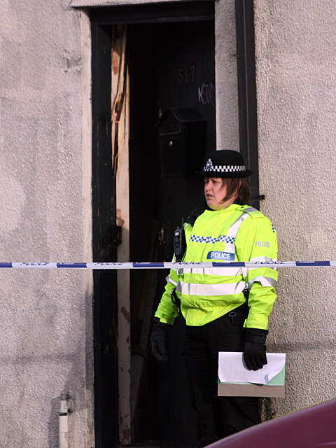 Door of the Internet cafe that was used by police to gain entry.