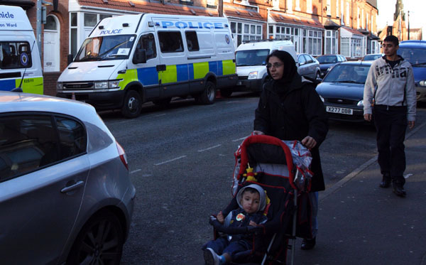 Durham Rd residents passing Police cordon at No 24