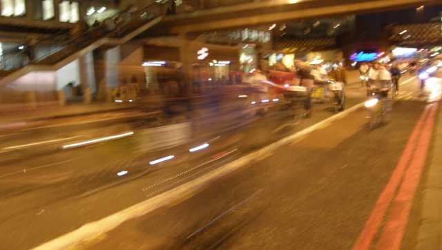Slow shutter speed reveals cyclist worldlines smeared out through spacetime...