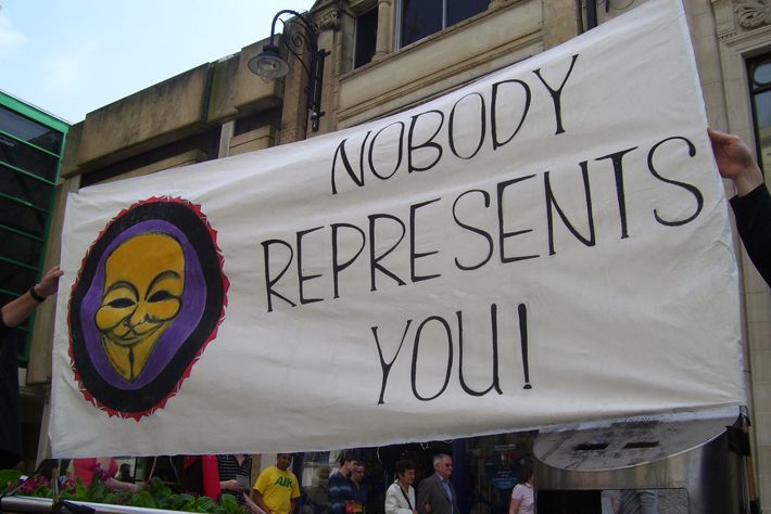 Banner, secured to a bin......