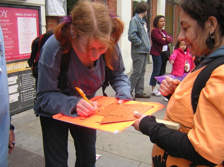 Strikers collecting signatures from passers by to support their demands ...