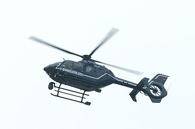 Airborne sound system playing loud repetitive industrial techno.