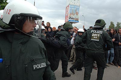 ...while more cops make a pointless arrest.