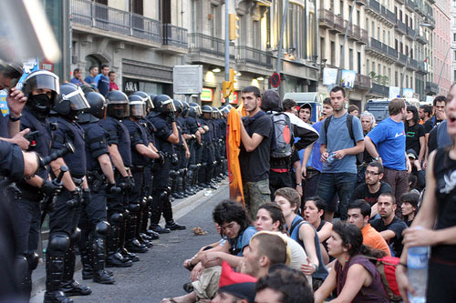 part of the crowd surrounded by lines of cops