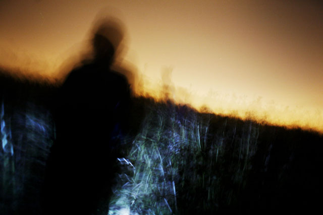Activists finding their way in the night to the site of the Climate Camp