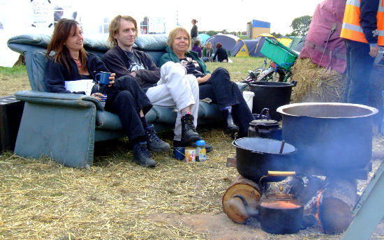 Three campers take a break on the living room sofa...
